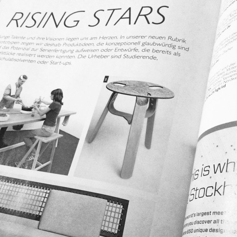 Artikel über "Rising Stars" mit Bildern von Möbeln und Kindern am Tisch.